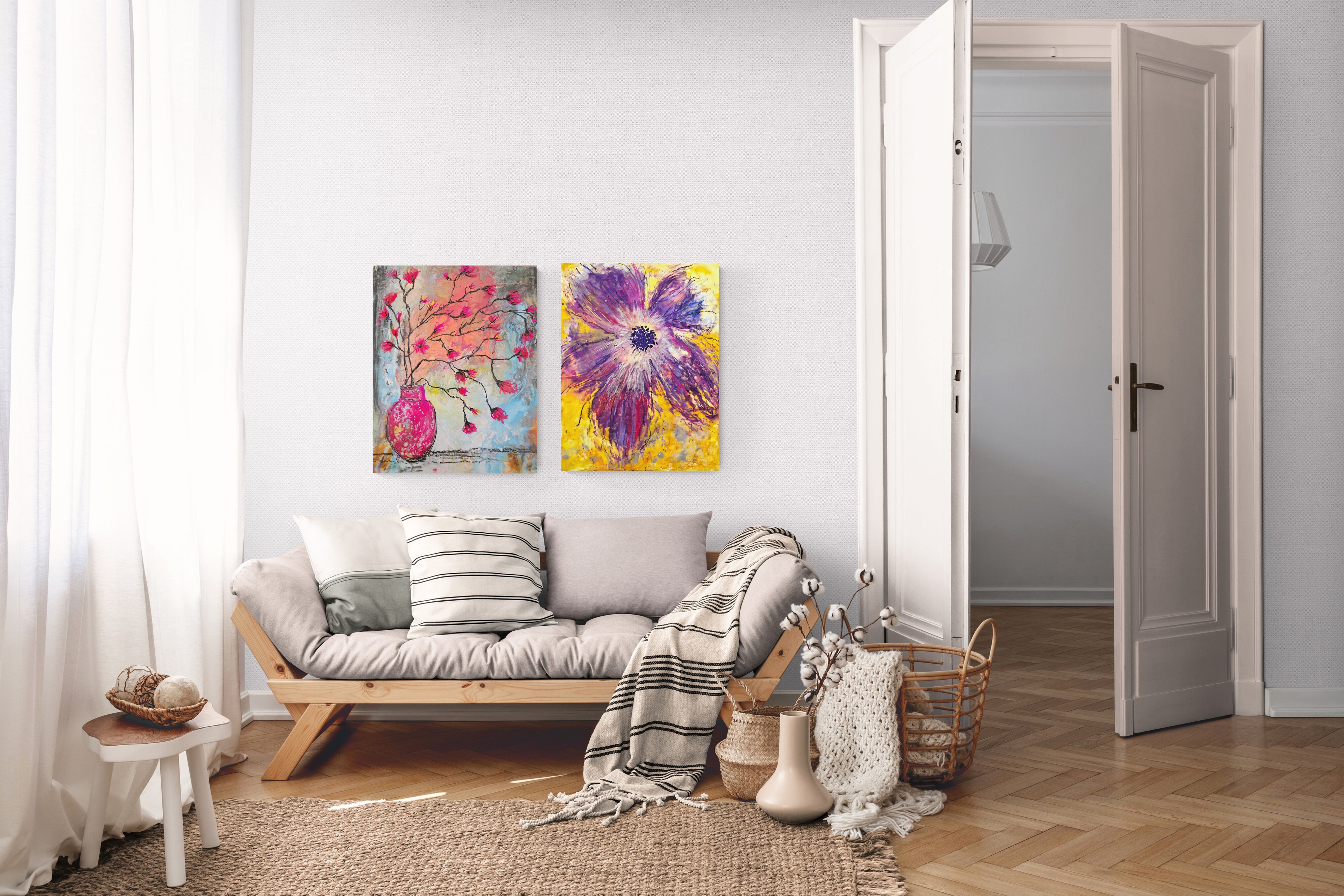 Living room with a sofa, decorative pillows, and colorful floral artwork on the wall.